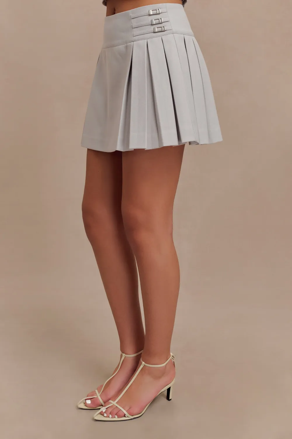 Pleated Buckle Mini Skirt