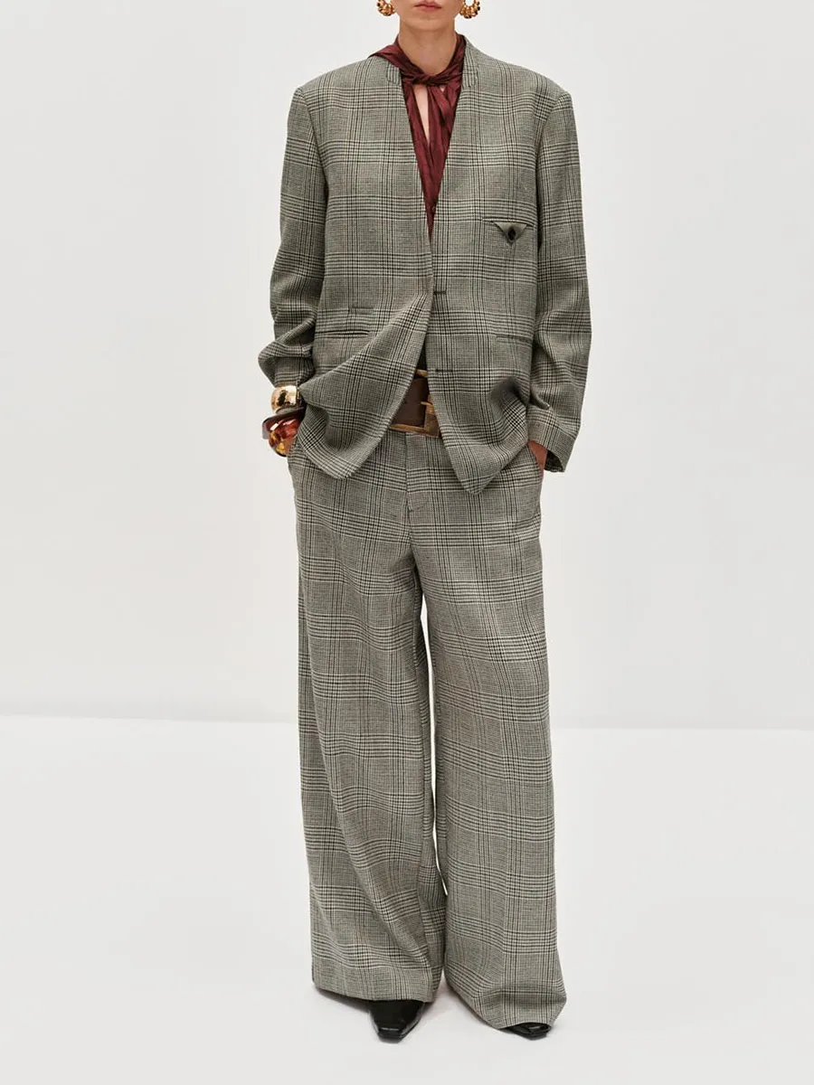 A Long Loose Coat In A British Style With A Checkered Suit For Women