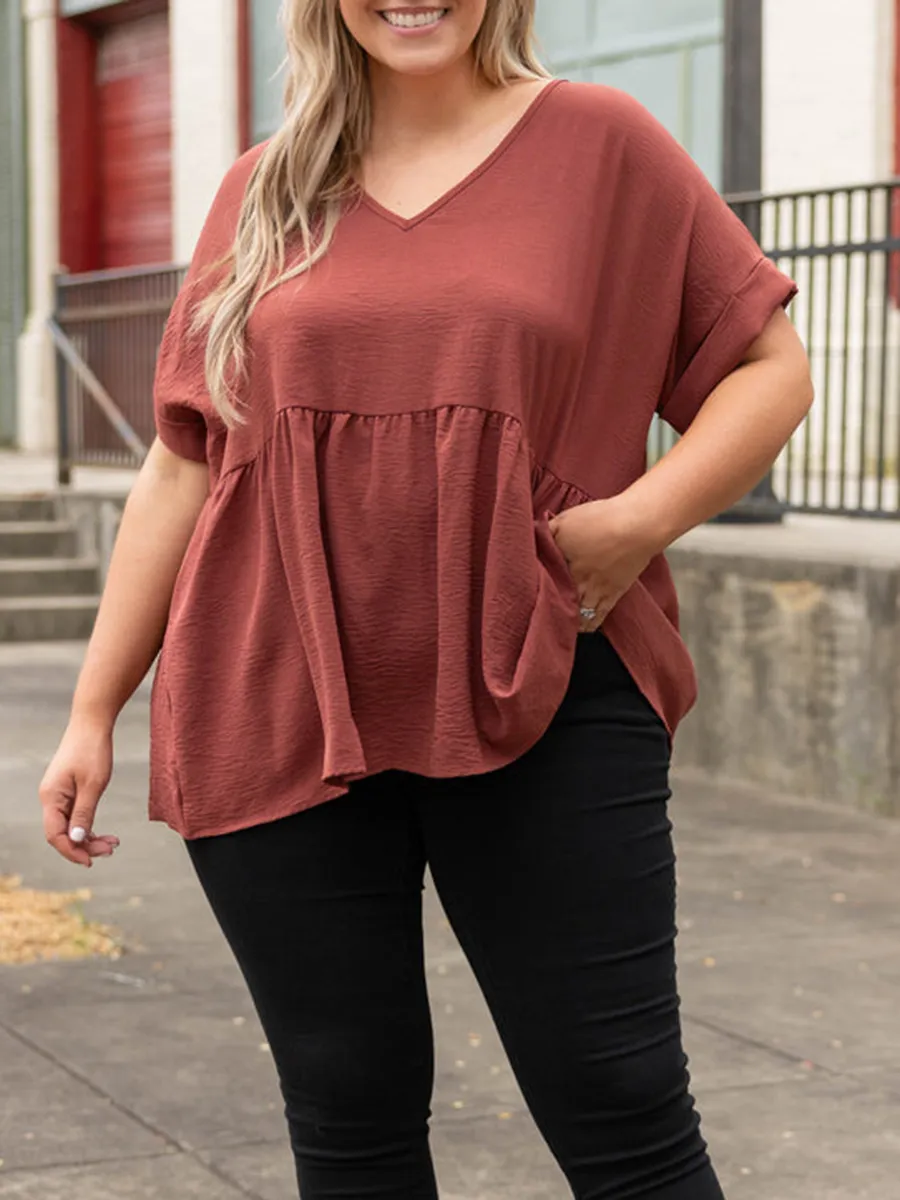 V-neck short sleeved shirt with ruffle hem