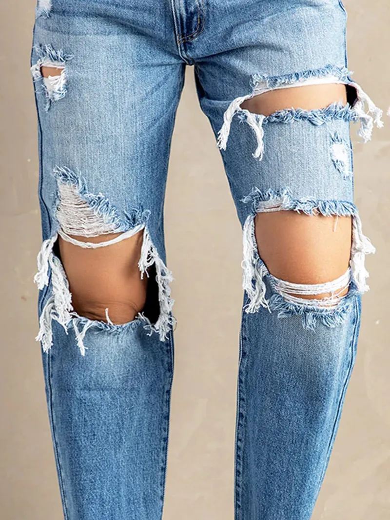 Women's washed ripped fringed jeans