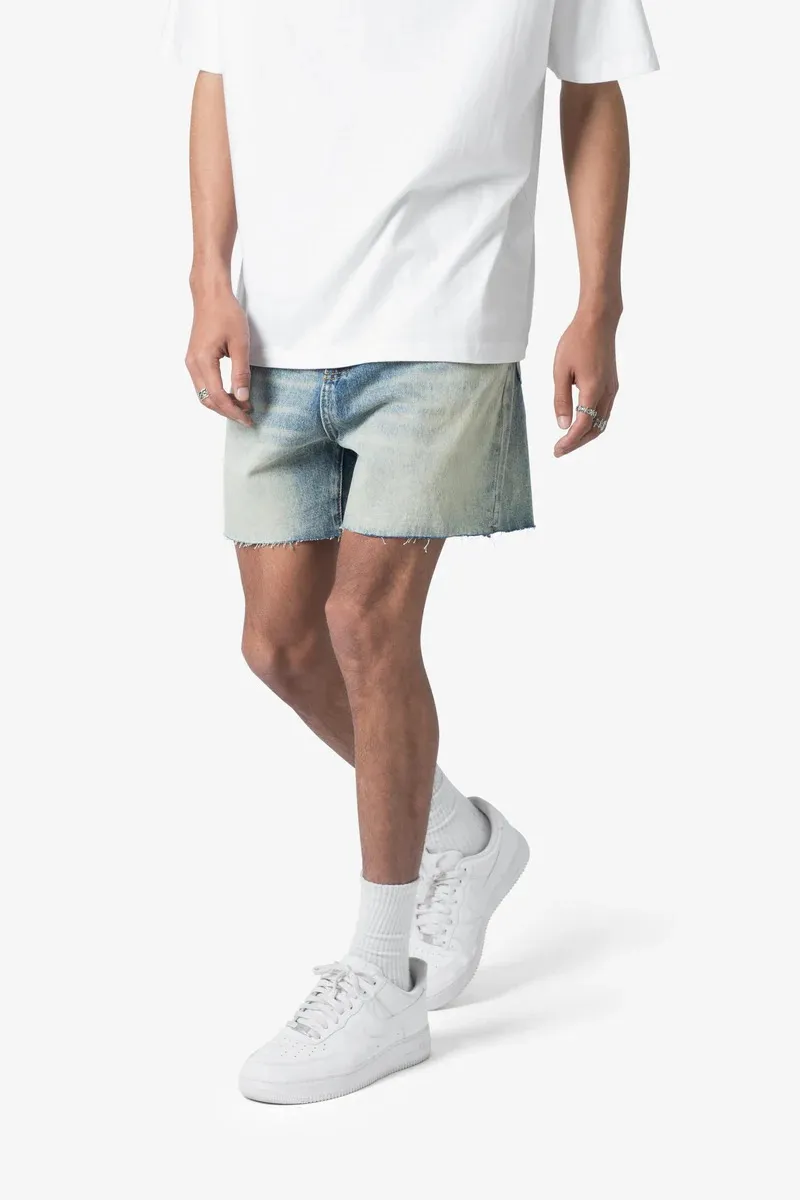 LIGHT BLUE DISTRESSED DENIM SHORTS