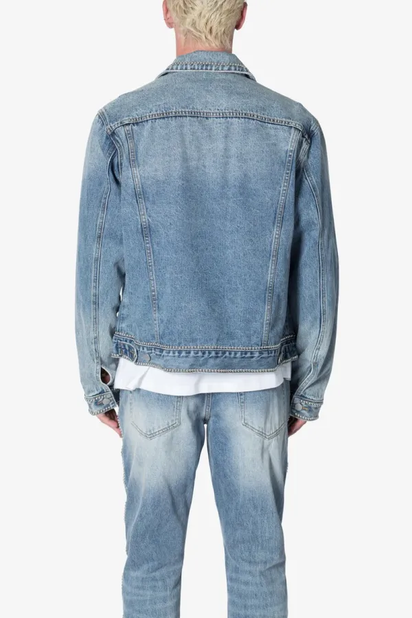 LIGHT BLUE DENIM STUDDED TRUCKER JACKET